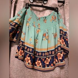 Hangs off the shoulder top.